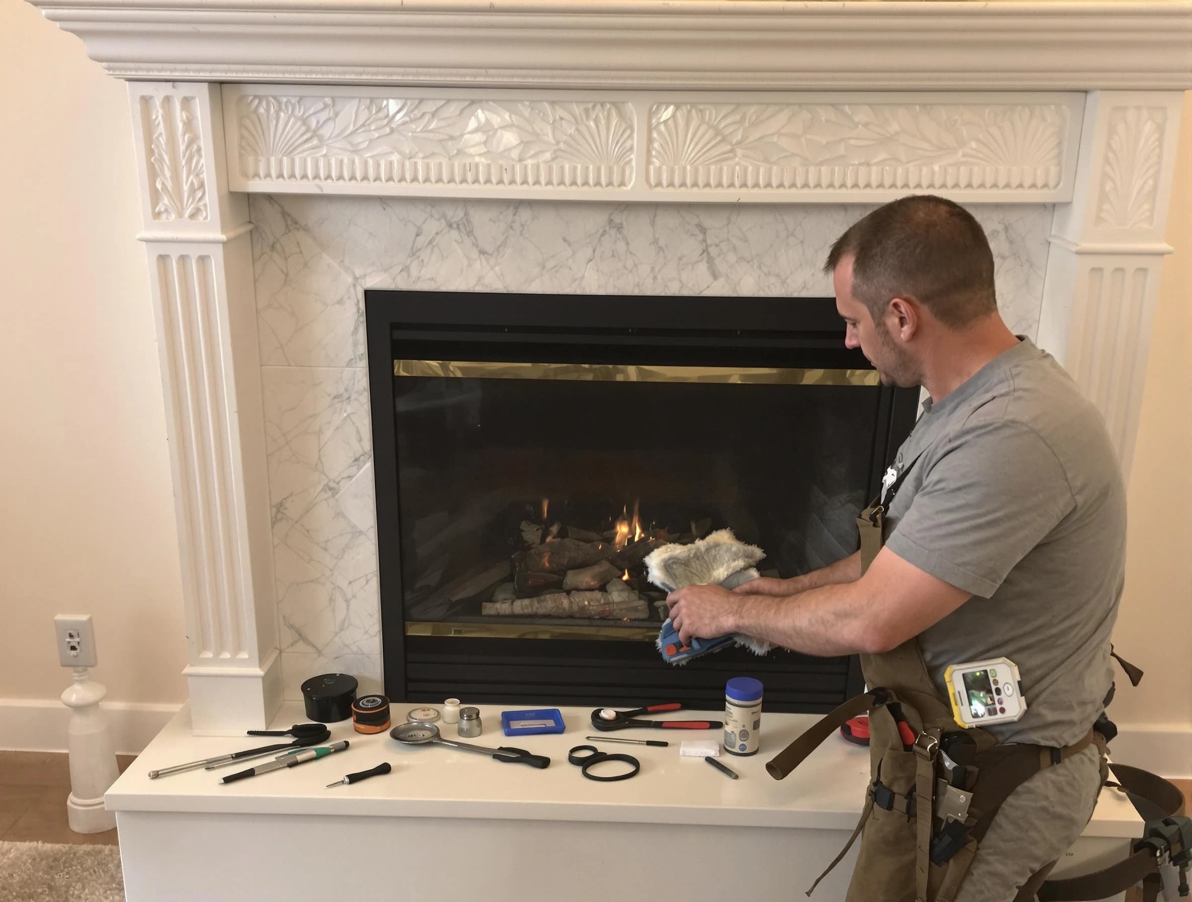 Malden Chimney Sweep performing fireplace maintenance in Malden, MA