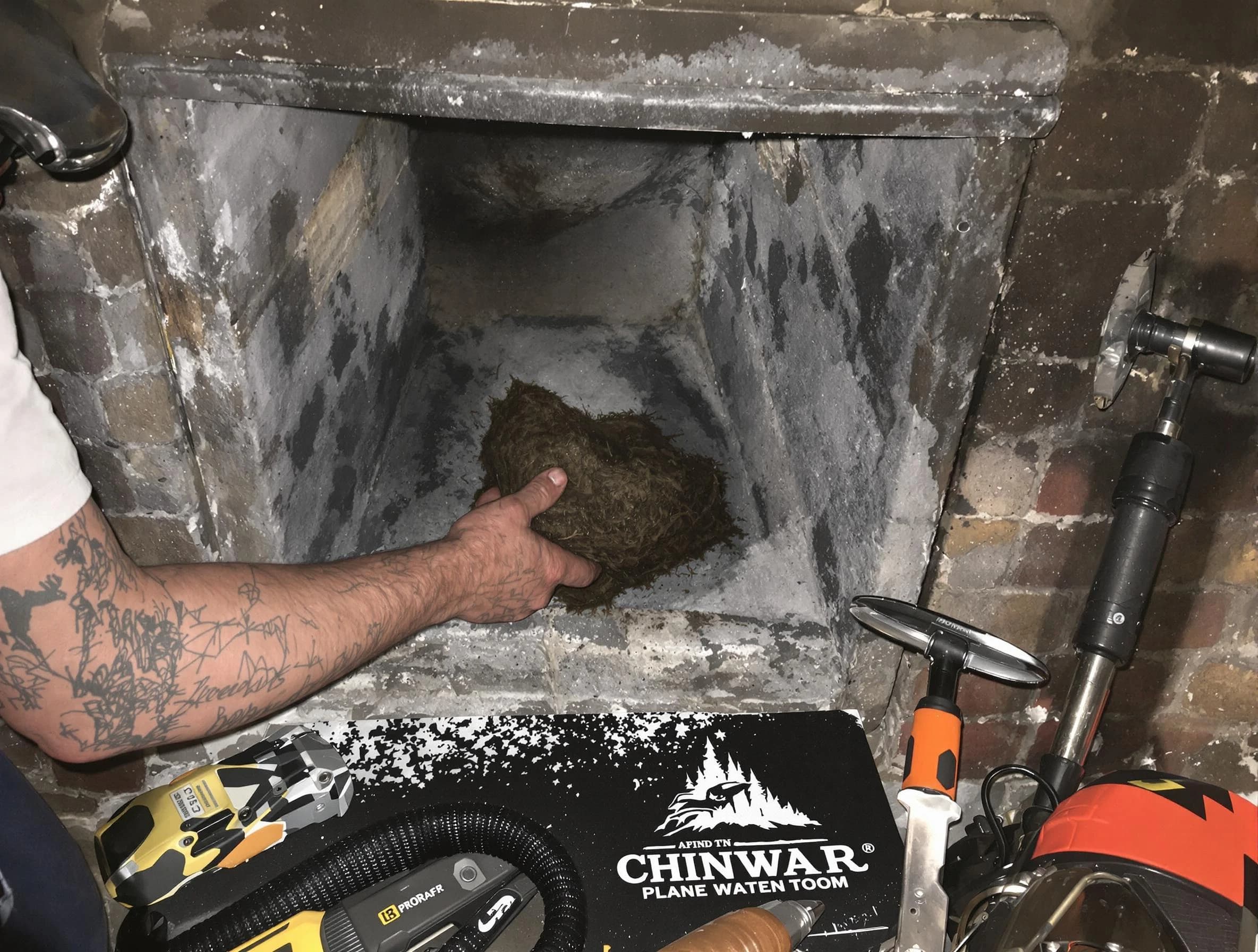 Malden Chimney Sweep safely removing debris and screening chimney in Malden, MA